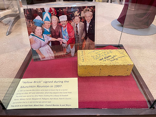 A yellow brick signed by 7 of the remaining actors who played the munchkins in the Wizard of Oz at a reunion at the Culver Hotel in 1997